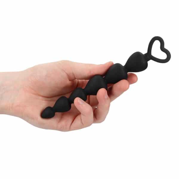 Black Silicone Anal Beads in hand