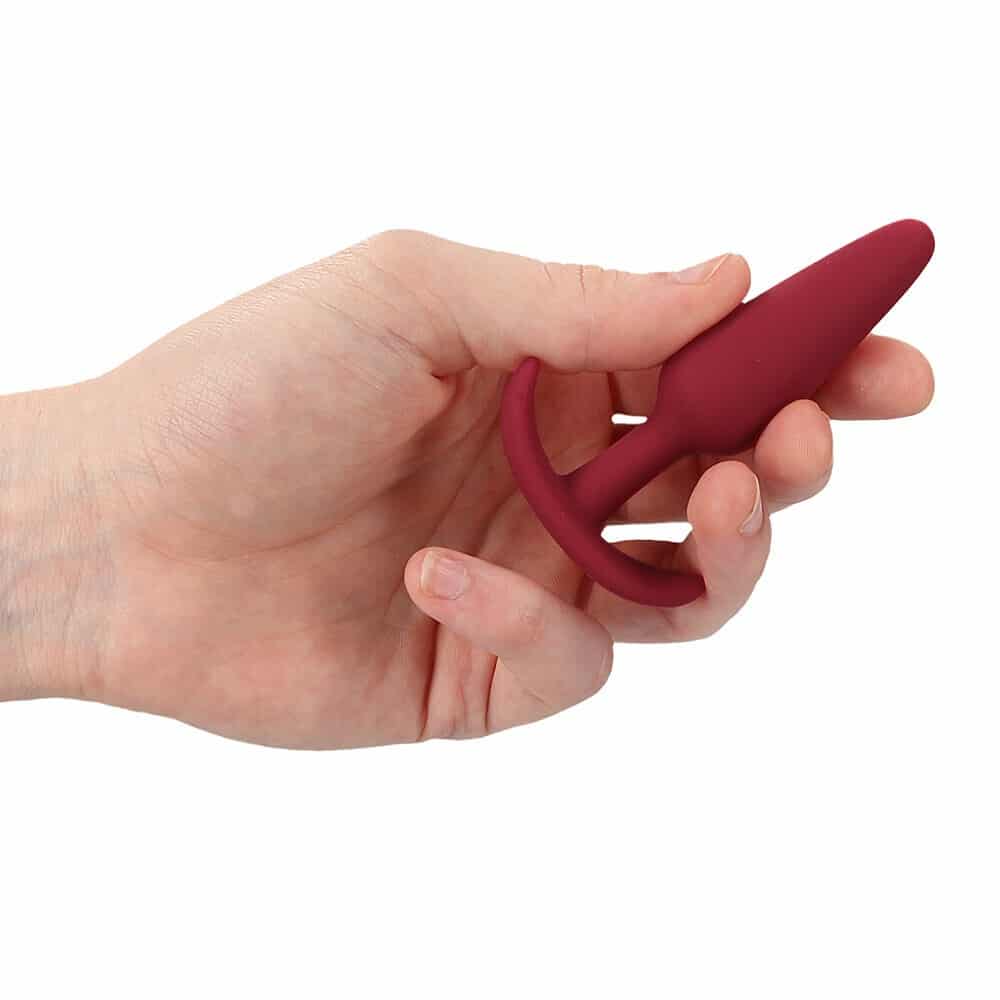 Beginners Size Slim Butt Plug (Red) in hand